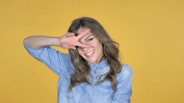 Slow Motion of Young Girl Dancing Isolated on Yellow Background