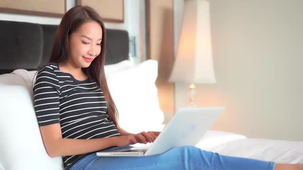 Young asian woman use laptop