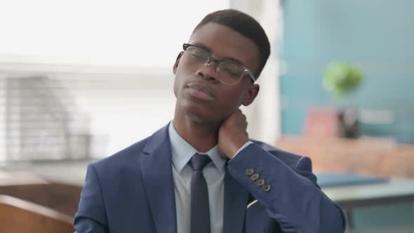 Young African Businessman Having Neck Pain