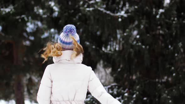 Happy Woman Running in Winter Forest or Park 10