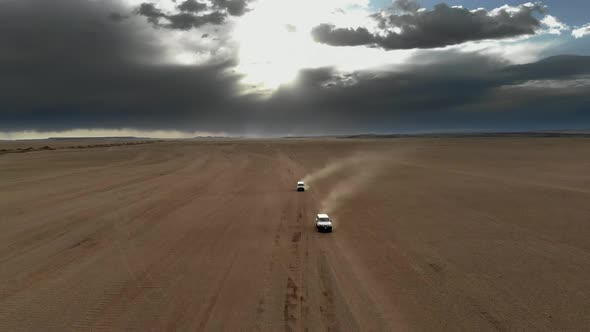 Vehicles Driving on Wide Dirt Roads in Central Asian Steppes