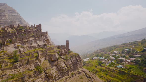 Ruins of ancient city on rocks on sunny day