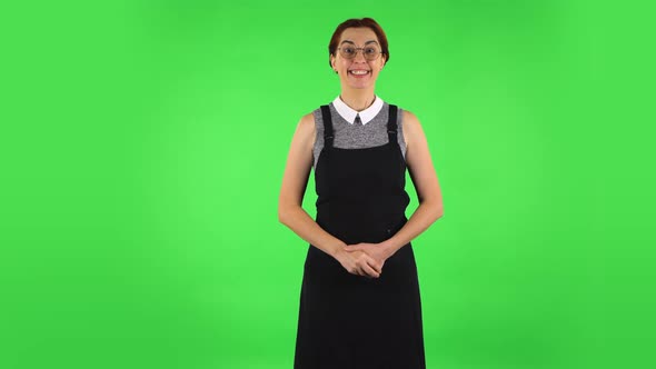 Funny Girl in Round Glasses in Anticipation of Worries, Then Disappointed and Upset. Green Screen