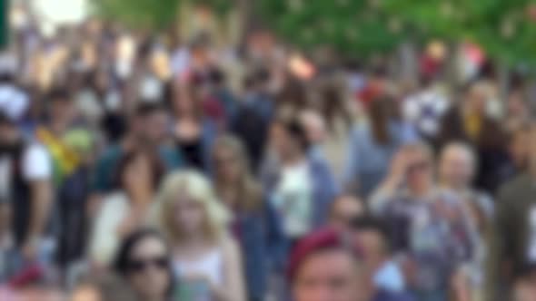 Silhouettes of People Walking in a Crowd