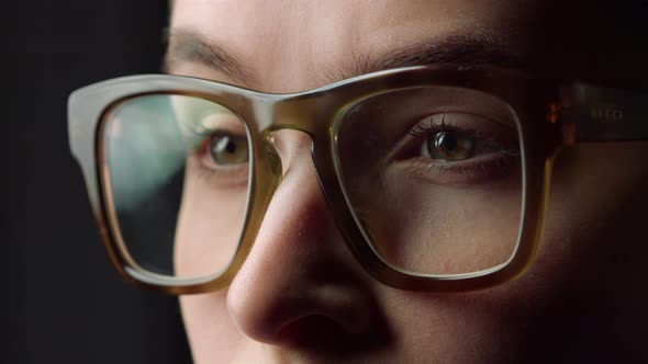 Macro Face Details of Surprised Business Woman Watching Something in Glasses