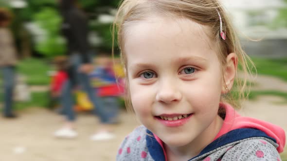 Little Girl Playing on Playground