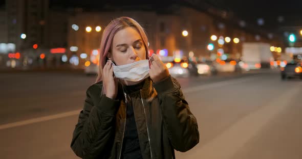 Sad Blonde Woman Puts on Special Medical Protective Mask