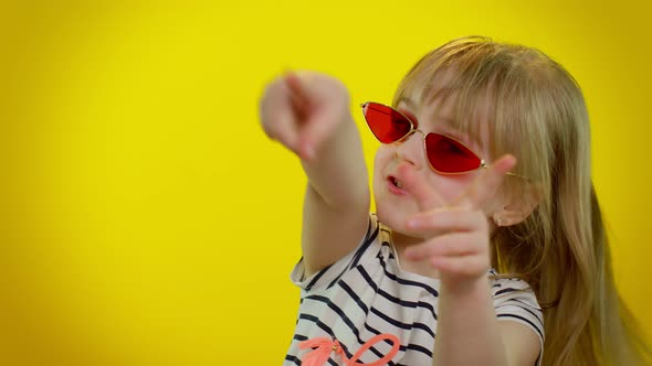Stylish Happy Kid Child Girl in Sunglasses Listening Music Dancing Disco Fooling Around Having Fun