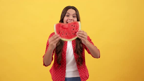 Amazed Kid Playing with Watermelon Fruit Slice on Yellow Background Fruit