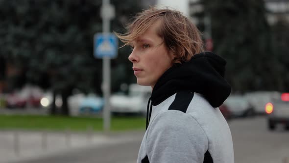 Slow Motion Video Portrait of Thoughtful Young Man in the City