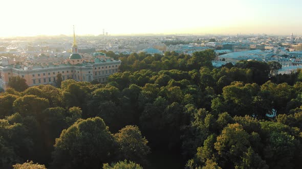 Historical palace surrounded by green park at sunrise