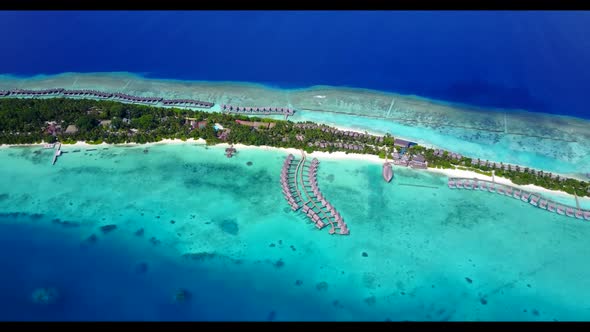 Aerial top down abstract of tropical bay beach lifestyle by blue water with white sand background of