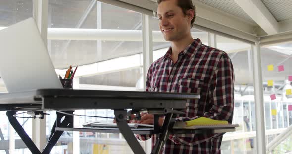 Young man working in a creative office