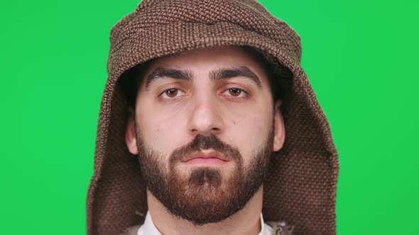 Portrait of a Man of Arab Appearance in Traditional Clothes a Man on the Background of a Chromakey