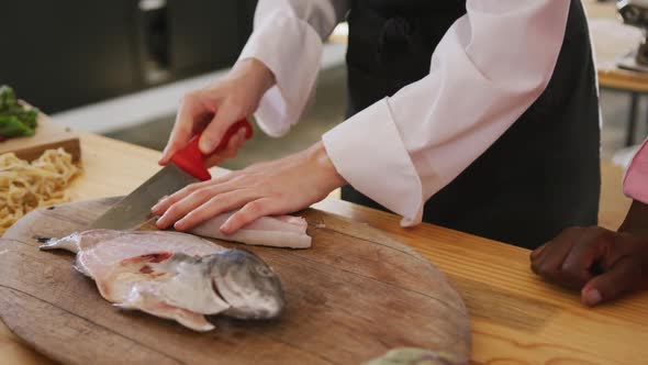 Chef cutting a fish