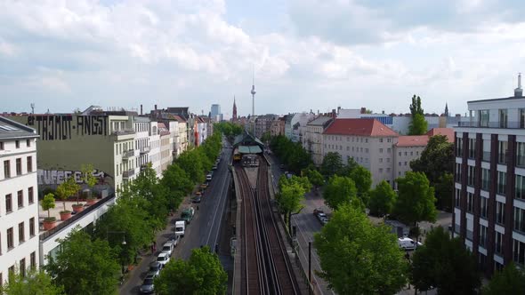 Panorama from public transport in station of elevated train tv tower.Smooth aerial view flight fly