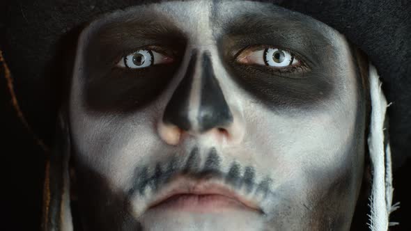 Close-up of Scary Man Face in Carnival Skull Halloween Makeup of Skeleton Looking Creepy at Camera