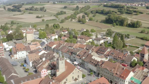 Aerial low overflight of Avenches main street and Roman arena. Vaud - Switzerland