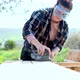 Woman sanding down wooden planks - VideoHive Item for Sale
