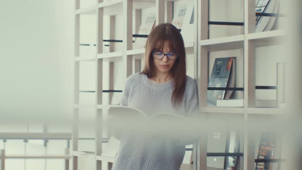 Attractive Girl Reading A Book