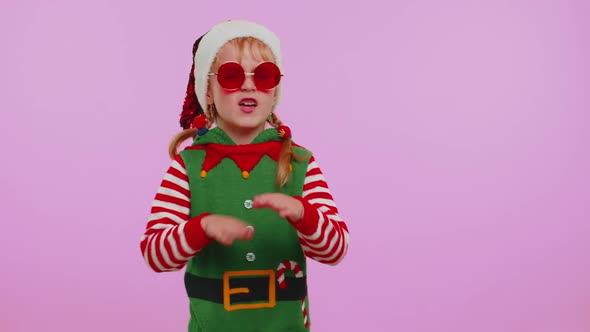 Girl Christmas Santa Claus Elf Listening Music Via Earphones Dancing Disco Fooling Around Having Fun