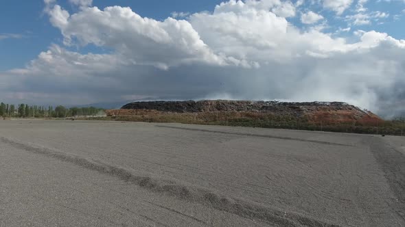 Empty Bottles, Plastic In The Waste Dump. Big Piles Of Garbage