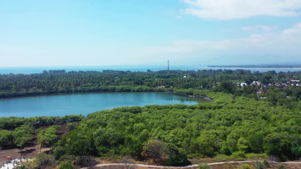 Aerial view seascape of perfect lagoon beach trip by blue sea and white sand background of a daytrip