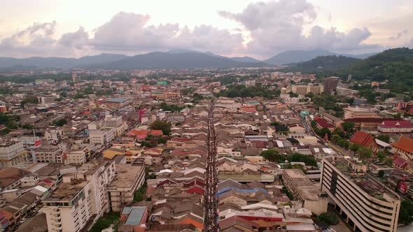 Aerial view Drone flying over phuket city Thailand.Drone over a street night market in Sunday day