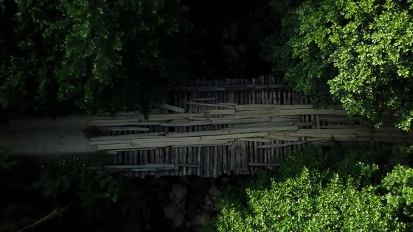 Top Down View of Wood Bridge Over the River in Caucasus Rainforest