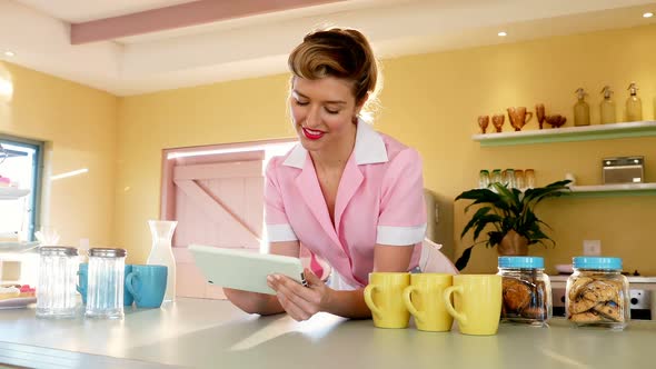 Waitress using digital tablet in restaurant 4k