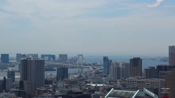 Timelapse, The aerial view of the sea and bridge in Tokyo