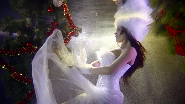 Winter Fairy Woman Is Moving in Water of Swimming Pool, Image of Snow Queen