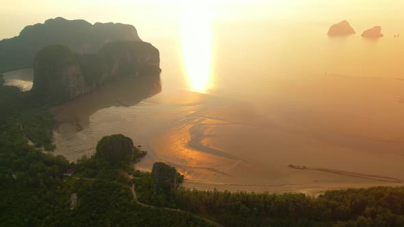 Aerial view over the coast, mountains and beaches during beautiful sunsets