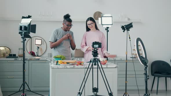 A Couple of Young People are Filming a Cooking Vlog Together