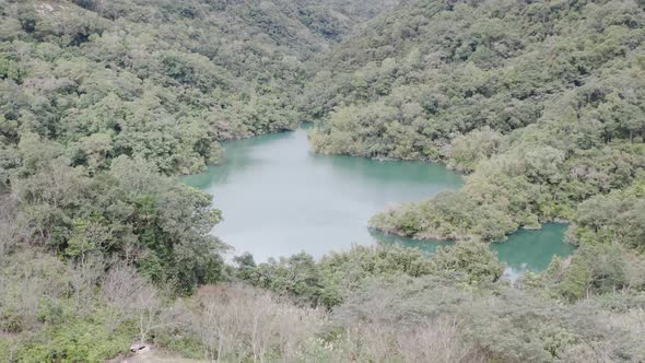 Ascending tilting camera view of Spectacular View of Feitsui Reservoir, Emerald lake, Thousand Islan