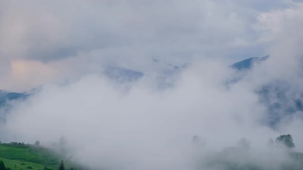 Time Lapse of Flowing Fog in Mountain Landscape