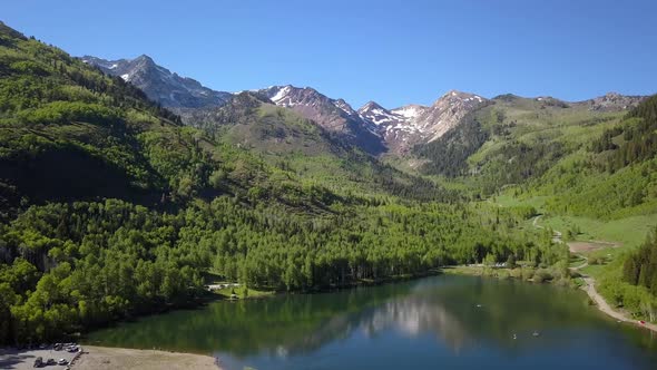 Aerial view flying over lake in the Utah mountains