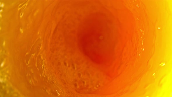 Super Slow Motion Shot of Orange Juice Vortex at 1000 Fps