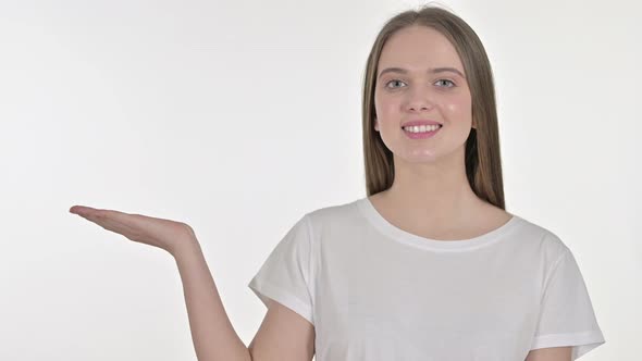 Young Woman Showing Product on Hand, White Background