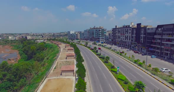 Model road with buildings and river drone view, cars running, Chitwan, Nepal