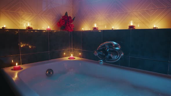 Bathtub with Romantic Scented Candles and Petals