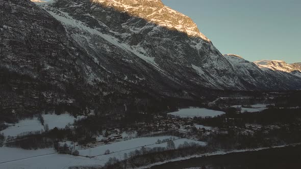 Sun Shining Through Mountainside In Norway - aerial shot