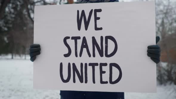 We Stand united is written. Challenge For People To Stay All Together and fight