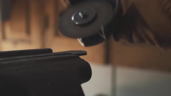 Grinding Tool Cutting Metal Close-up. Unrecognizable Machine Operator Working with Polishing Machine alt