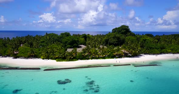 Tropical overhead island view of a paradise sunny white sand beach and blue ocean background in hi r