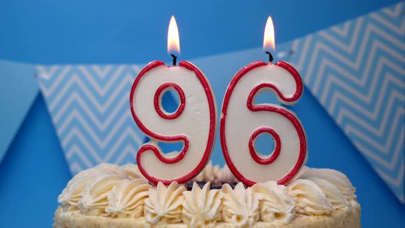 Happy birthday. 96 year, cupcake, birthday cake with candles on a blue background.close-up alt
