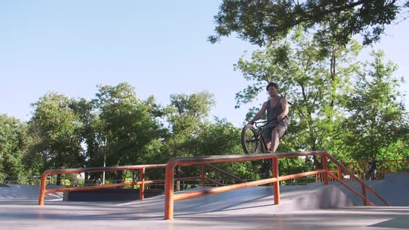 BMX Rider Doing Tricks in Cocncrete Skatepark Super Slow Motion