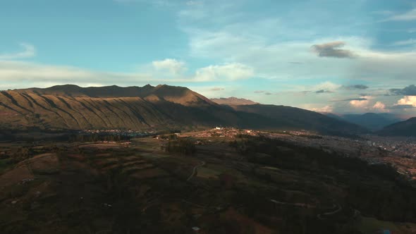 4k aerial drone footage over the Northern hills and mountains of Cusco in Peru at sunset. Dolly in w