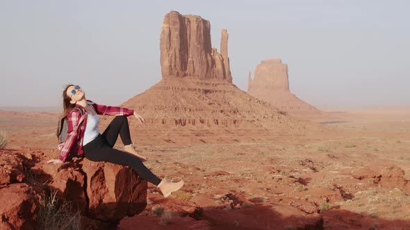 Happy Smiling Woman Scenic Red Canyon Catching Wind with Hand Freedom Emotion