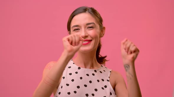 Close-up Video Portrait of a Young Adult Woman Looking at Camera.